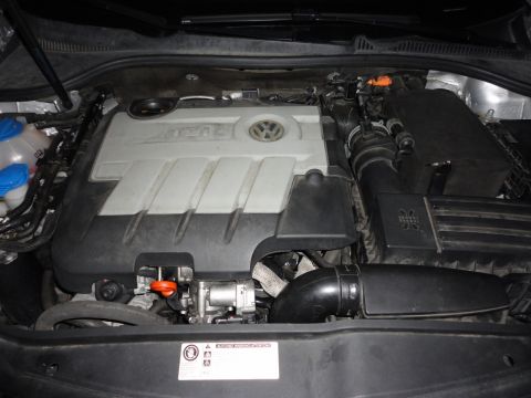 2010 Volkswagen Jetta - Engine bay view showing the TDI engine cover with Volkswagen branding. The registry claims this is a 2010 Jetta, but the photo does not con…
