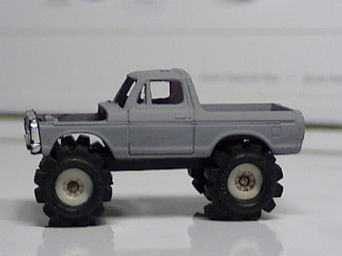 1979 Ford Bronco - This 1979 Ford Bronco features a lifted suspension and oversized tires, giving it a monster truck appearance.