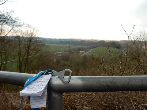 2010 Audi A4 - A bottle opener and notepad are attached to a metal railing with a view of a valley.