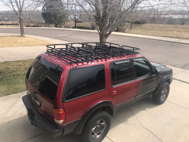 Red 2000 Ford Explorer with roof rack