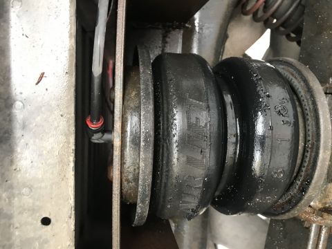 1997 Dodge 3500 - Close-up of an Air Lift suspension bellows, showing part numbers and text on the rubber component.