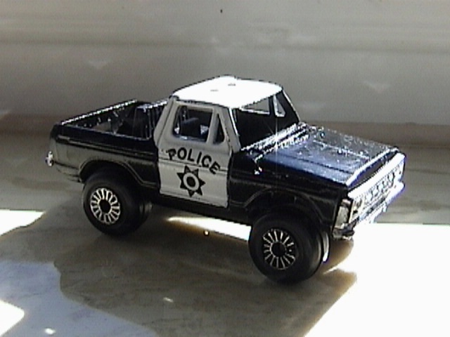 toy police pickup truck with 'POLICE' on door