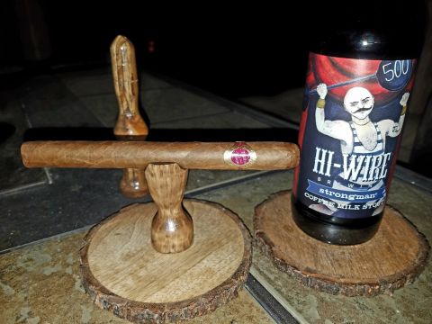 2018 Ford Bronco - A cigar and a craft beer bottle are displayed on rustic wooden coasters.