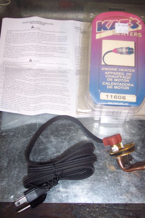 1995 Ford Bronco - Engine heater kit includes installation instructions and the heater unit with its power cord.