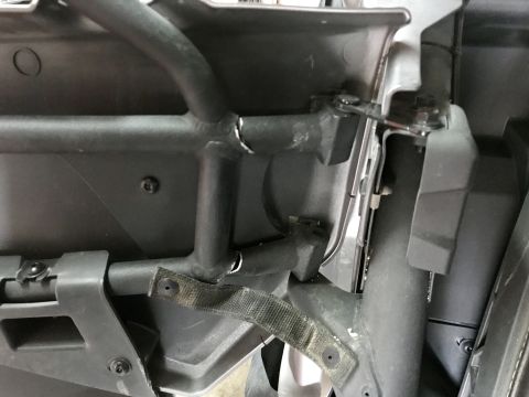 1988 Ford Bronco - Close-up view of the interior roll cage and door panel structure.