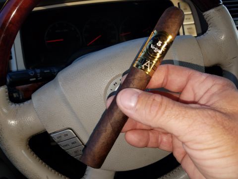 2018 Ford Bronco - Cigar held in front of car dashboard and steering wheel, with '5 Vegas' band visible.