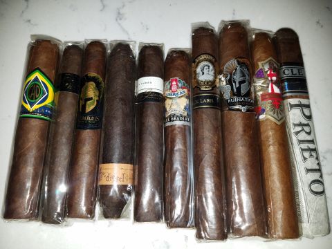 2018 Ford Bronco - A variety of cigars are displayed, each individually wrapped in cellophane with distinct branding.