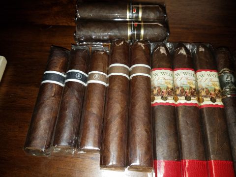 2018 Ford Bronco - A collection of cigars with distinct bands is arranged on a wooden table.