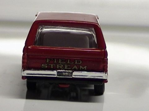 1979 Ford Bronco - This red SUV features "FIELD AND STREAM" badging on its tailgate, seen from the rear.