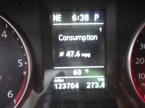 2010 Volkswagen Jetta - The car's dashboard displays fuel consumption at 47.6 mpg and a total mileage of 123,704 miles.