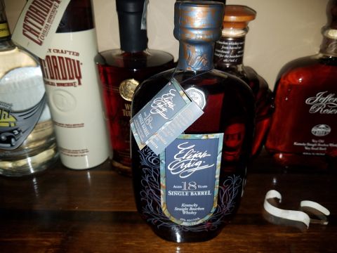 2018 Ford Bronco - A collection of whiskey bottles displayed on a shelf, Elijah Craig 18 Years Single Barrel.