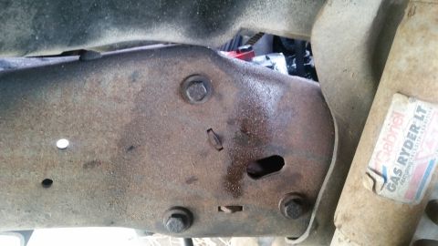 1985 Ford Bronco - Close-up of rusted vehicle frame showing a Gabriel Gas Ryder LT shock absorber sticker.