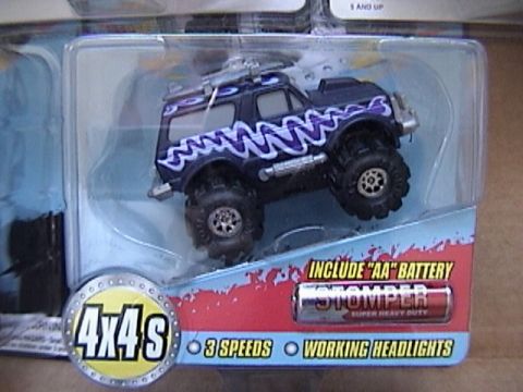 1979 Ford Bronco - This toy monster truck, labeled 'Stomper Super Heavy Duty', is packaged with '4x4s', '3 Speeds', and 'Working Headlights' callouts.