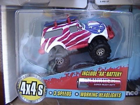 1979 Ford Bronco - Toy monster truck with patriotic paint scheme is packaged with battery and features.