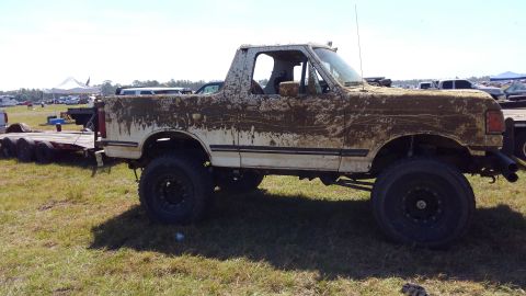 1988 Ford Bronco - This heavily mud-splattered 1988 Ford Bronco appears to have recently participated in off-road activities.