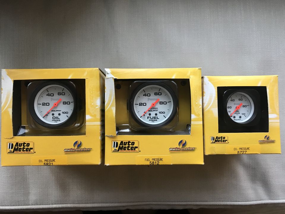 Three Auto Meter gauges: oil pressure, fuel pressure, and oil pressure