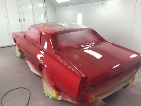 1968 Mercury Cougar - Classic car undergoing a fresh coat of paint inside a professional spray booth.