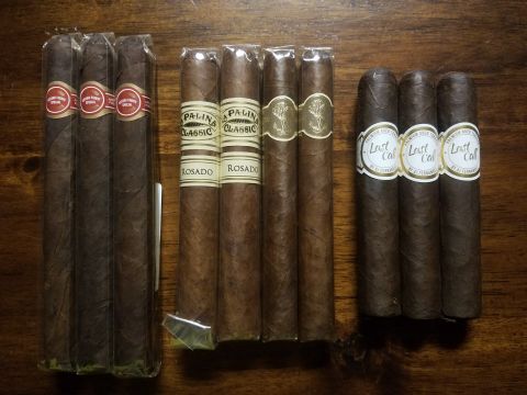 2018 Ford Bronco - A collection of cigars, different brands and wrappers, arranged on a wooden table.