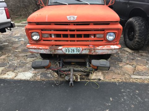 1961 Ford F-350 - This 1961 Ford F-350 is equipped with a snow plow attachment, as seen from the front.