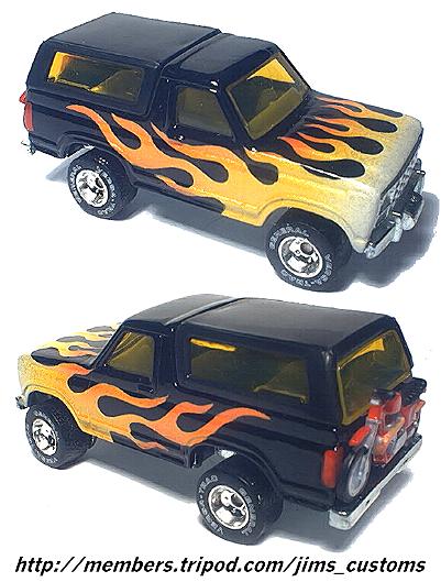 1979 Ford Bronco - black die-cast Ford Bronco model with hot-rod flame graphics shown from front and rear three-quarter angles.