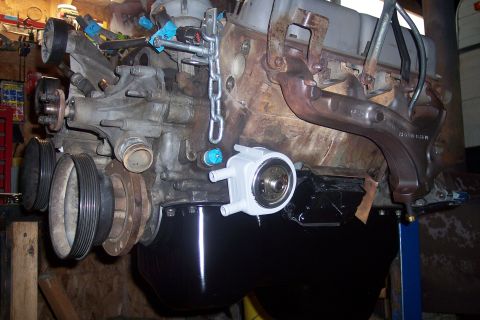 1995 Ford Bronco - Engine assembly, likely a Ford 351W, is suspended for service or repair.