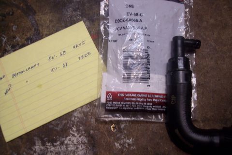 1995 Ford Bronco - Ford PCV valve and associated part numbers noted on a yellow legal pad.