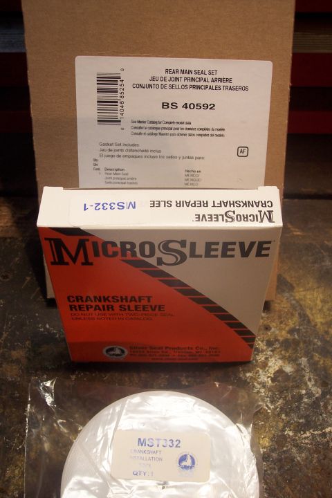 1995 Ford Bronco - Packaging for automotive repair parts, including a rear main seal set and a crankshaft repair sleeve.