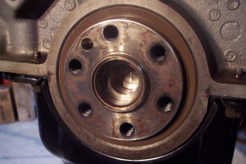 1995 Ford Bronco - Engine crankshaft seal area showing wear and rust on the metal components.