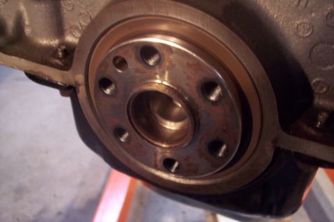 1995 Ford Bronco - This is a close-up view of a crankshaft flange, likely from an engine undergoing maintenance.