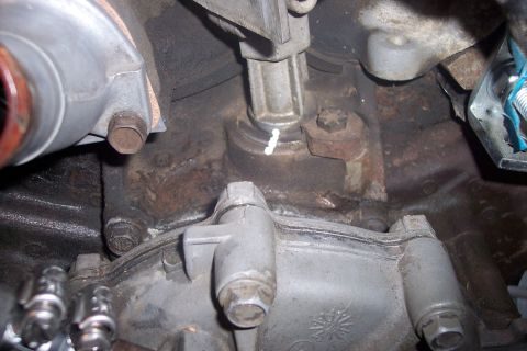1995 Ford Bronco - Detail of an engine part, possibly from a 1995 Ford Bronco, with a visible white marking.