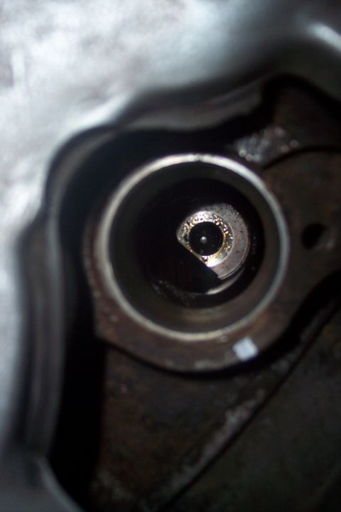 1995 Ford Bronco - A close-up view of an engine cylinder, showing internal components and wear.