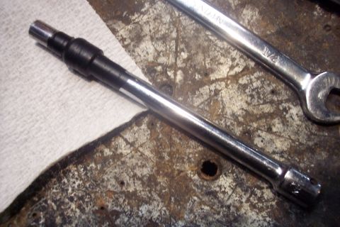 1995 Ford Bronco - Chrome shaft with black grip and a wrench on a workbench.