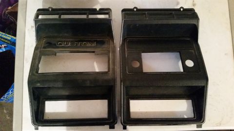 1985 Ford Bronco - Two dashboard trim pieces, one labeled "CUSTOM", are shown side-by-side, ready for installation.