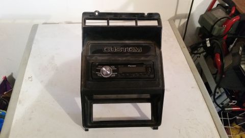 1985 Ford Bronco - This is a dashboard speaker install panel with a Pioneer radio and "CUSTOM" badging.