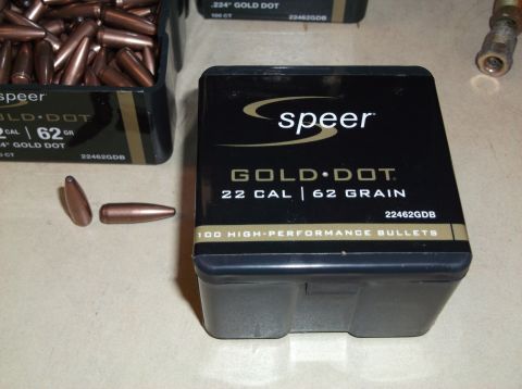 1995 Mercury Grand Marquis - Speer Gold Dot 22 Cal 62 Grain bullets are shown in their packaging and loose.