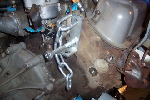 1995 Ford Bronco - Close-up view of an engine block a custom-made chain hoist bracket.