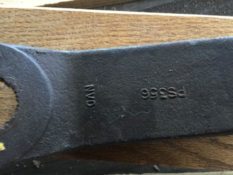 1967 Ford Custom Wagon - A close-up view of a metal component with embossed lettering and numbers.