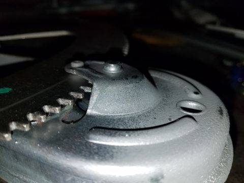 1968 Ford Bronco - A close-up view of a vehicle's window regulator mechanism, showing the gears and mounting points.