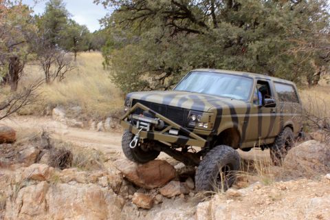 1996 Ford Bronco - This modified Ford Bronco navigates a challenging off-road trail.