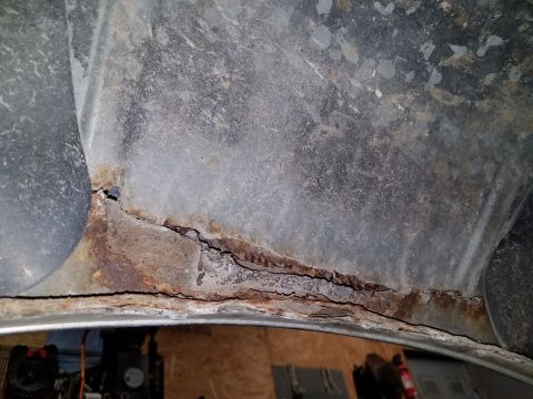 1987 Ford Bronco - Significant rust damage is apparent in the wheel well, indicating potential structural compromise.