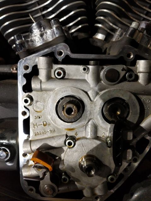 2014 Harley-Davidson FXDWGI Wide Glide - Close-up of a Harley-Davidson engine part, showing stamped numbers that indicate a 1999 model year.