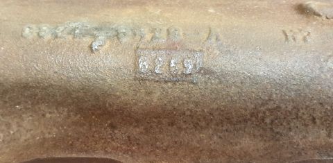 1973 Ford Mustang - Close-up of a cast iron part showing stamped identification numbers.