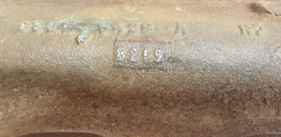 Cast iron part with stamped numbers '6269' and other markings