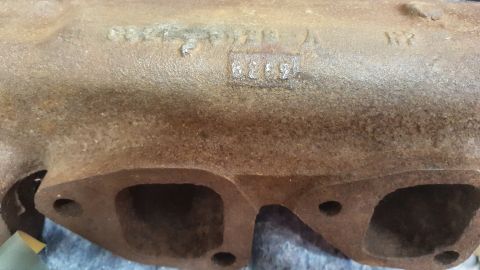 1973 Ford Mustang - Close-up of an exhaust manifold showing casting numbers, including 6259 and WY.