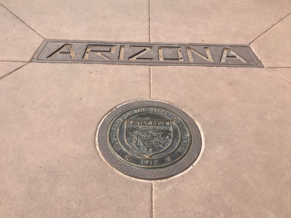Great Seal of the State of Arizona set in concrete sidewalk