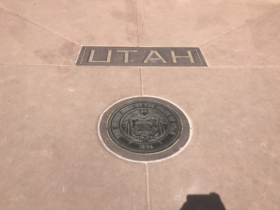 The Great Seal of the State of Utah and the word UTAH embedded in a tiled floor.