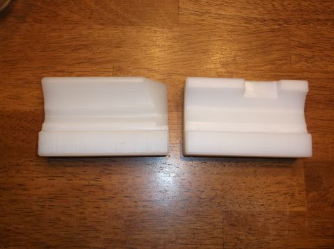 1995 Mercury Grand Marquis - Two white plastic parts are shown on a wooden surface. The parts appear to be custom-made or aftermarket components, possibly for a vehicle…