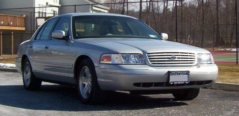 2002 Ford Crown Victoria - Silver 2002 Ford Crown Victoria sedan seen from a three-quarter front angle.