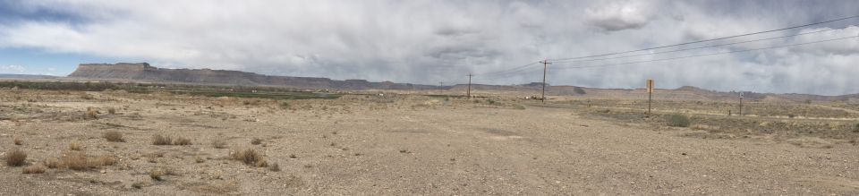 Dry landscape with mesa and power lines