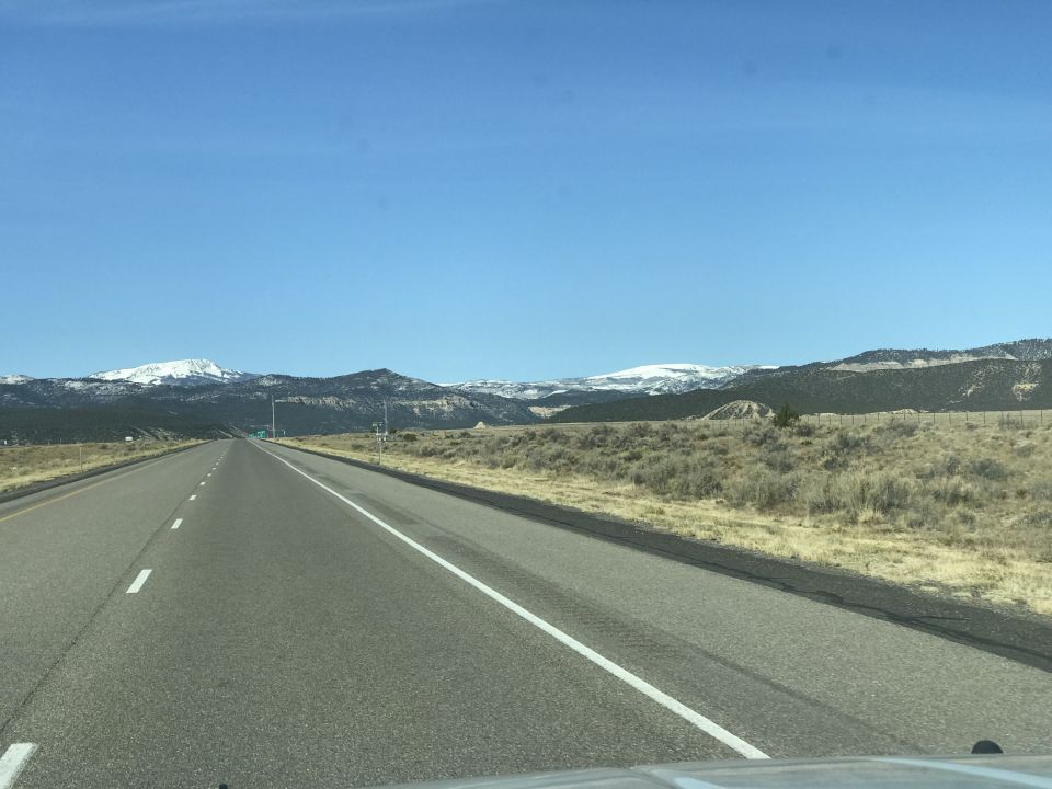 Highway leading to snow-capped mountains
